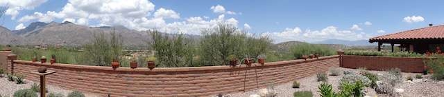 Mountains visible to left, right, and through *windows* in the trees